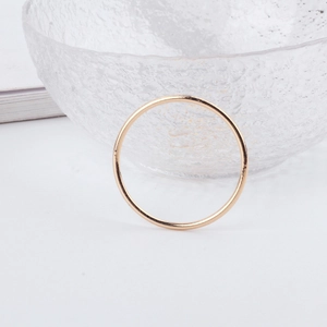 Minimalist golden round ring charm for DIY jewelry displayed on a clean aesthetic background