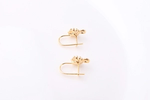 Macro shot of 18k gold plated flower stud earring DIY findings with U-shaped hook connectors