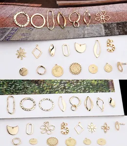 Detailed view of assorted gold-plated geometric charms and pendants for DIY jewelry making
