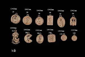 Macro shot of twelve vintage coin pendants in gold plating with detailed portraits