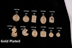 Detail of vintage gold alloy coin pendants with embossed portraits and dimensions