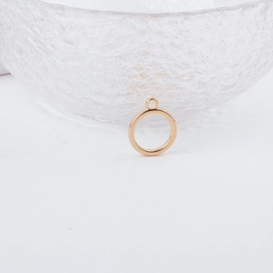 Close-up of polished gold circular geometric charm for DIY jewelry and earrings