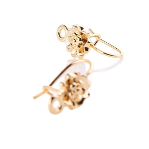 Polished gold floral U-shaped earrings with layered petals and small hanging loop