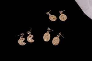 Three pairs of vintage gold coin earrings with embossed portraits and zircon details