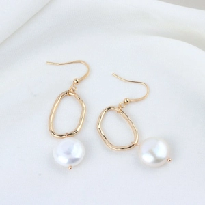 Elegant gold alloy branch branch earrings with white baroque pearl pendants on white silk