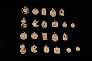 Assorted gold vintage coin pendants and cameo charms for DIY jewelry making