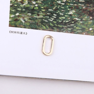 Detailed view of oval gold metal pendant accessories for DIY jewelry making