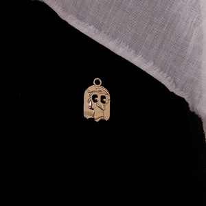 Detail of vintage gold coin pendant with portrait relief and S925 sterling silver stamp