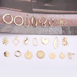 Assorted gold irregular geometric charms and portrait pendants for DIY jewelry making