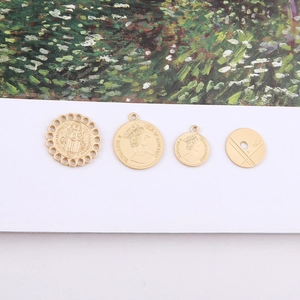 Set of four gold vintage irregular metal pendants featuring Elizabeth II relief designs
