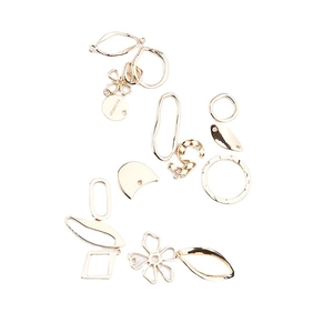 Golden irregular geometric charms for DIY jewelry making including flower and leaf shapes