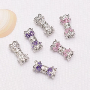 Detail view of 14K gold-filled pave zircon bowknot connectors for jewelry making