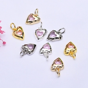 Macro view of 14K gold plated irregular heart charms with micro-pave zircons for DIY jewelry