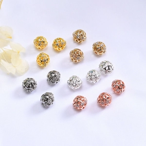Macro detail of 14K gold filled hollow zircon beads in gold silver and rose gold finishes