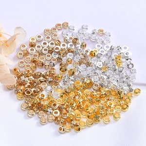 Macro shot of 14K gold plated wheel spacer beads for DIY jewelry making and crafts
