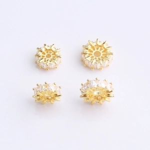 Macro shot of 14K gold plated wheel beads with micro-pave zircons for DIY jewelry making