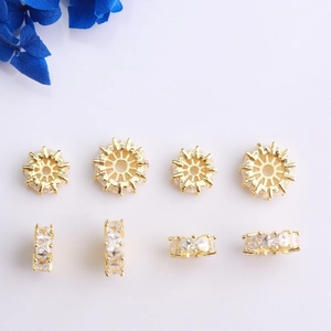 Detailed macro view of 14K gold plated wheel spacer beads with sparkling zircon inlay