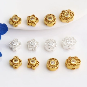 Detailed view of hollow floral spacers in gold and silver with cubic zirconia inlays