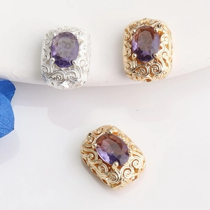 Macro detail of 14K gold plated hollow beads with purple zircon stones for DIY jewelry