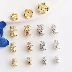 Macro shot of gold and silver crown spacers with inlaid cubic zirconia for DIY jewelry