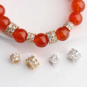 Red agate bead bracelet with 14K gold plated micro-inset zircon wheel spacers