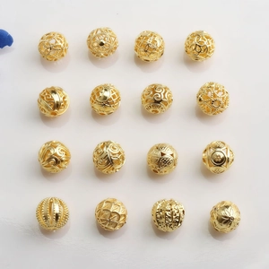 Set of sixteen 14K gold plated hollow beads with diverse intricate patterns for jewelry DIY