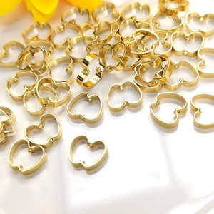Detail of 14K gold plated apple shaped hollow frame beads for jewelry making