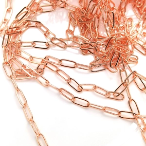 Macro shot of 14k gold-filled paperclip chain links with rose gold finish for DIY jewelry