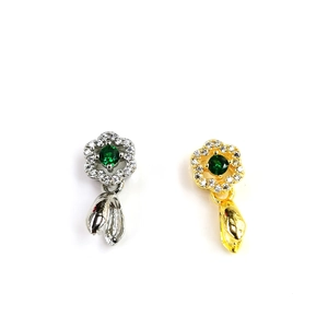 18k gold plated flower pendant with green center stone and diamond inlay in gold and silver