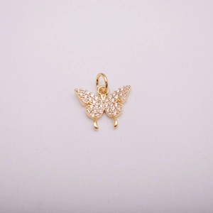 Detailed macro view of 14K gold butterfly pendant featuring micro-set cubic zirconia stones