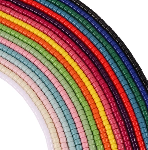Macro shot of colorful acrylic cylinder beads for DIY jewelry and necklace crafting