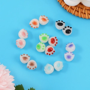 Macro view of colorful acrylic cat paw beads for DIY bracelet and necklace making