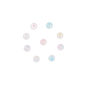 Macro detail of round iridescent acrylic beads with holes for DIY jewelry making