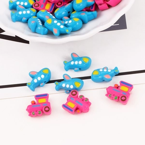 Colorful acrylic beads in airplane and train shapes for DIY jewelry making and crafts