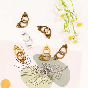 Freedom engraved metal handcuff pendants in gold, silver and bronze for DIY jewelry