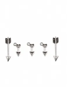 Macro detail of vintage silver heart arrow charms for DIY necklace and bracelet jewelry