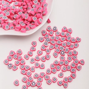 DIY colorful heart-shaped clay beads with floral patterns for jewelry making