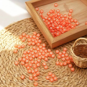 Flat round orange acrylic letter beads for DIY jewelry making and handmade bracelets
