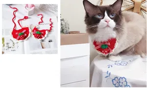 Handmade strawberry crochet cat bib with red knit pattern and white lace edge detail