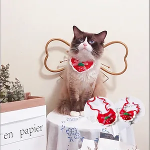 Handmade knitted strawberry bib for cats and dogs with white lace trim and bow knot