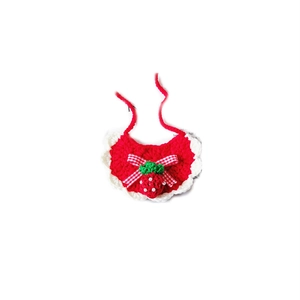 Handmade knitted red strawberry pet bib with white ruffled edges and a plaid bow