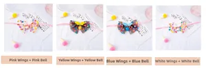 Detail of colorful polka dot mesh pet collars with wings and bells in four pastel colors