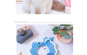 Close-up of hand-knitted pet collar with blue flower pattern and soft cotton texture