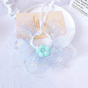 Detail of pet lace collar with daisy embroidery and mint green crochet flower accessory