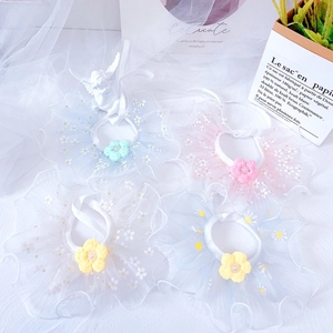 Detail showing pet lace collars with floral crochet accents and pearl bead decorations