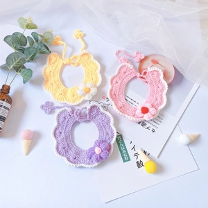 Handmade crochet pet collars with puff flowers in yellow, pink, and purple yarn colors