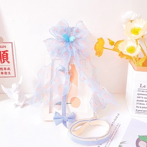 Detail of light blue pet harness with peach print, mesh bow and 3D wings accessory
