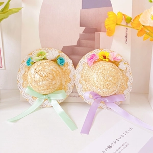 Pet straw hat with colorful floral accents, white lace trim and pastel ribbon ties