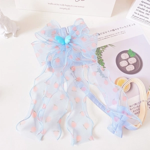 Detail of light blue mesh bow pet harness with peach pattern and plaid leash set
