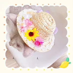 Detail of straw pet hat with white lace trim and purple satin bow for cats and dogs